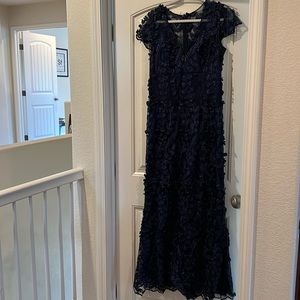 Gorgeous, formal navy blue dress with flower appliqué. Size 6.
